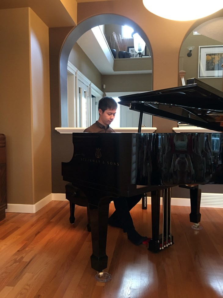 Han Chen playing Piano